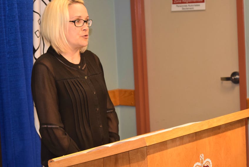 Anne MacGregor congratulates members of the with Pictou County Roots for Youth Society for their many achievements in the past year at the society’s AGM on Wednesday evening.