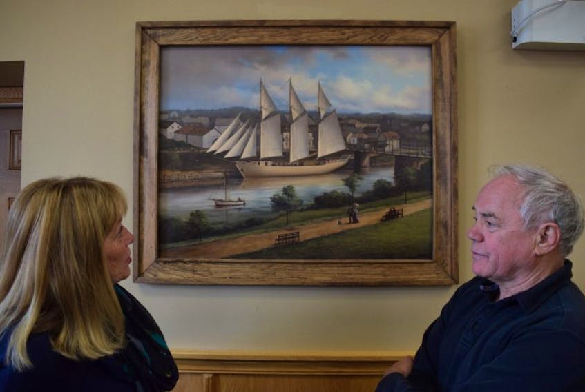 New Glasgow Mayor Nancy Dicks and Deputy Mayor Clyde Fraser took time to admire and discuss the newly unveiled portrait of the iron-hull schooner James William – a vessel built in New Glasgow in 1908, and lost five years later, when it ran aground. Pictou Artist David MacIntosh painted the schooner to commemorate Canada’s 150th anniversary.