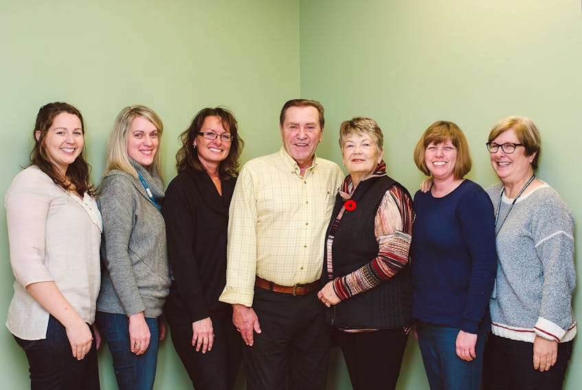 Of the all the health services Wade McCann receives at the One Door Centre to manage his chronic illnesses, he is most appreciative of his care team, a team which includes his wife, Marjorie. From left: Pamela Palmer, nurse practitioner; Angela Childs-Filmore, dietitian; Rhonda Dykstra, respiratory therapist; Wade and Marjorie McCann; Lisa Cook, RN; Janice Fraser, manager. – PHOTO COURTESY OF THE ABERDEEN HEALTH FOUNDATION