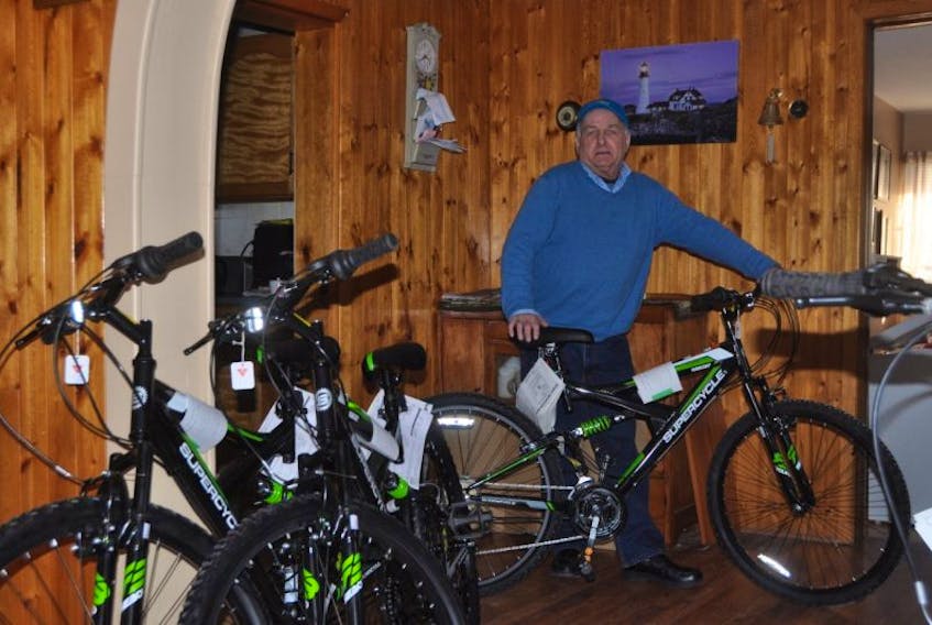 Philip MacKenzie stands with bikes he was recently able to purchase thanks to local donations. The bikes are going to be used by the volunteer staff and campers at the Atlantic Burn Camp in Cape Breton this summer.
