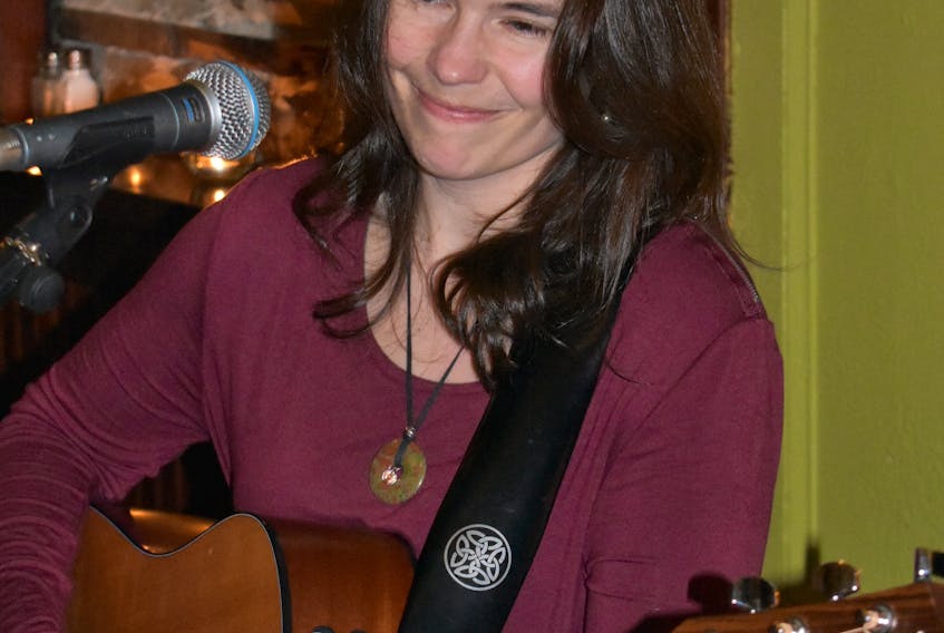 Heather Cameron plays for the crowds at The Dock in New Glasgow on Saturday night for her music therapy fundraiser drive.