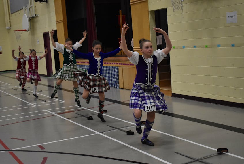 Several Highland dancers perform a sword dance on Sunday, in Pictou.