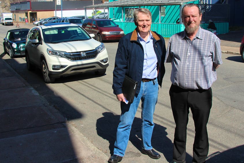 Pictou town councillor Malcolm Houser, left, and Pictou Business and Marketing Society chair Barry Randle are encouraging businesses that pay into the town’s business development district tax to apply to its new façade improvement program, which will match funds up to $2,500 for improvements to the fronts of businesses. Applications are available at the town hall after May 15.