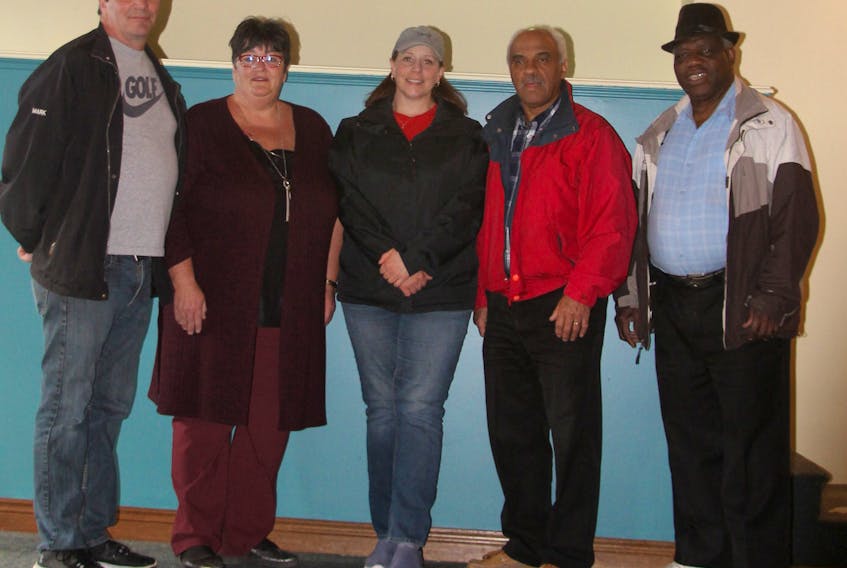 Viola’s Place Society board members held their first meeting in the shelter after purchasing the building on Marsh Street, New Glasgow. From the left are board members Mark Firth, Karen MacPhee, Nancy MacCulloch, Brian Bowden and Moses Adekola.