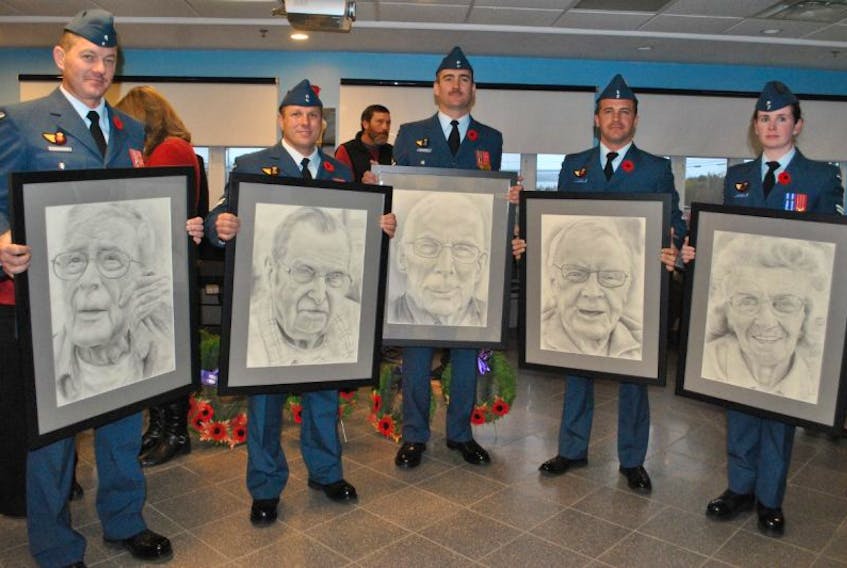 Members of the 144 Construction Engineering Flight in Pictou presented portraits of five veterans during the Remembrance Day service at the Northumberland Veterans Unit on Friday. From left, Warrant Officer Corey Chisholm holding Jim Woodacre's portrait, Cpl. Ron Murphy holding Clem Guthro's portrait, Sgt. Andrew MacDonald holding Stan Porter's portrait, Lt. Marc Lukaszczyk-Therien holding Russell McKinley's portrait, and Cpl. Nicole MacKenzie holding Jean Fraser's portrait. 