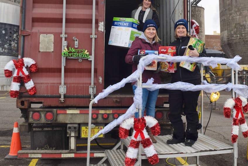 Pictured accepting donations on Monday are Laura Turner, Aaron Christensen and Kathy Cloutier.