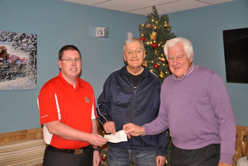 Brian MacIntosh, president of the New Glasgow Kinsmen Club, left, donates a cheque for $1,000 to Riverview Home resident Donald Morrison, and volunteer association president Clarrie MacKinnon. The money will go toward recreation initiatives for residents of Riverview Home.
