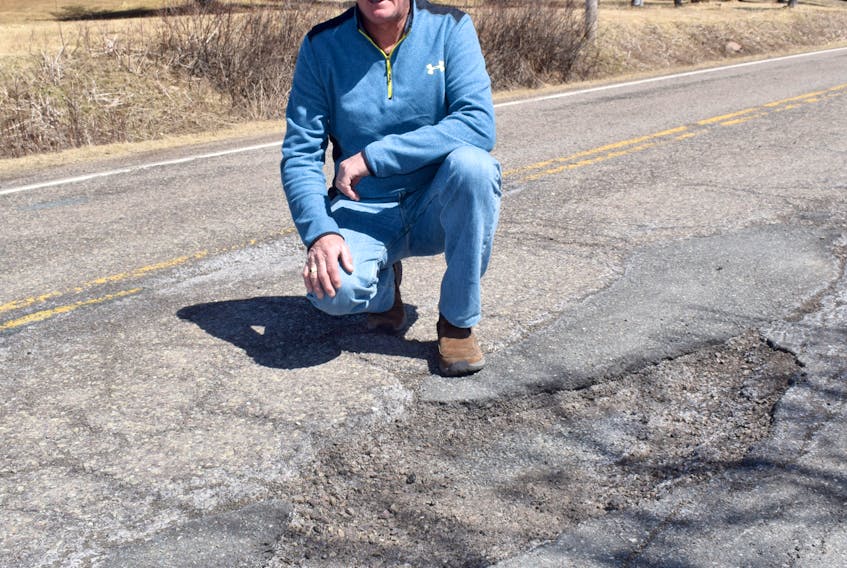 Somewhere near Rocky Mountain in rural Pictou County, Blaine Yerxa points out a pothole on Highway 347.