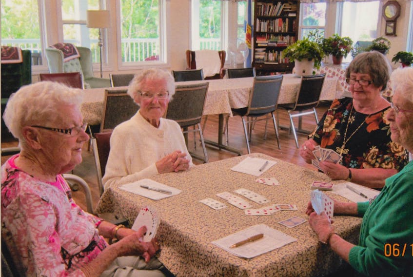 These women believe that playing the card game bridge has helped to  keep their minds sharp as they aged. Here, from the left: 103-year-old Helen Ward and her sister 101-year-old Gertriude MacDonald play a round with 76-year-old Audrey MacGillivray and 92-year-old Jean Hopton.