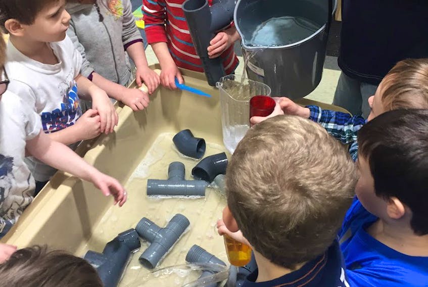 Pictured are some of the children from the pre-primary program at New Glasgow Academy last school year. The students learn through play-based learning. Here, they are exploring loose parts during water play. Sensory play experiences are part of daily programming in pre-primary classrooms.