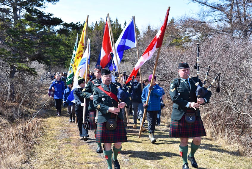 Guests march toward the cairn commemorating the Battle of Culloden in Knoydart, on Saturday afternoon.