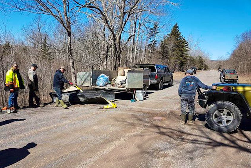 Members of the North Nova - Nova Scotia Jeep Club did their part to help clean up the earth on a rural Pictou County road/gravel pit last weekend.