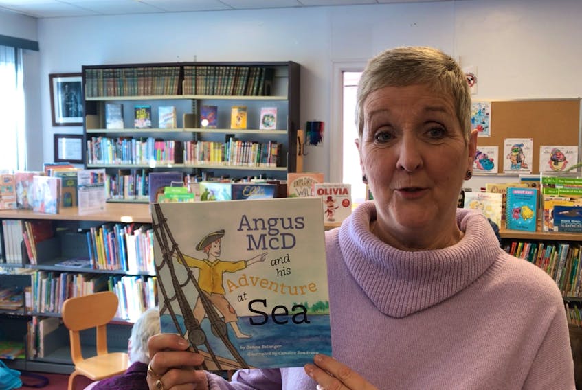 Local author Donna Belanger with her book Angus McD and his Adventure at Sea during Family Literacy Day at Pictou Library Saturday.