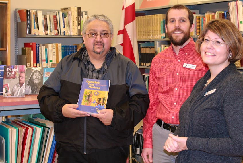 The eight-pointed Mi’kmaq star, is now featured in collections in the Pictou-Antigonish Regional Libraries’ branches. From left: Gerald Gloade, artist and Program Educator with the Mi’kmawey Debert Cultural Centre; Greg Hayward, Technical Services Librarian and Trecia Schell, Community Services Librarian with Pictou-Antigonish Regional Library.