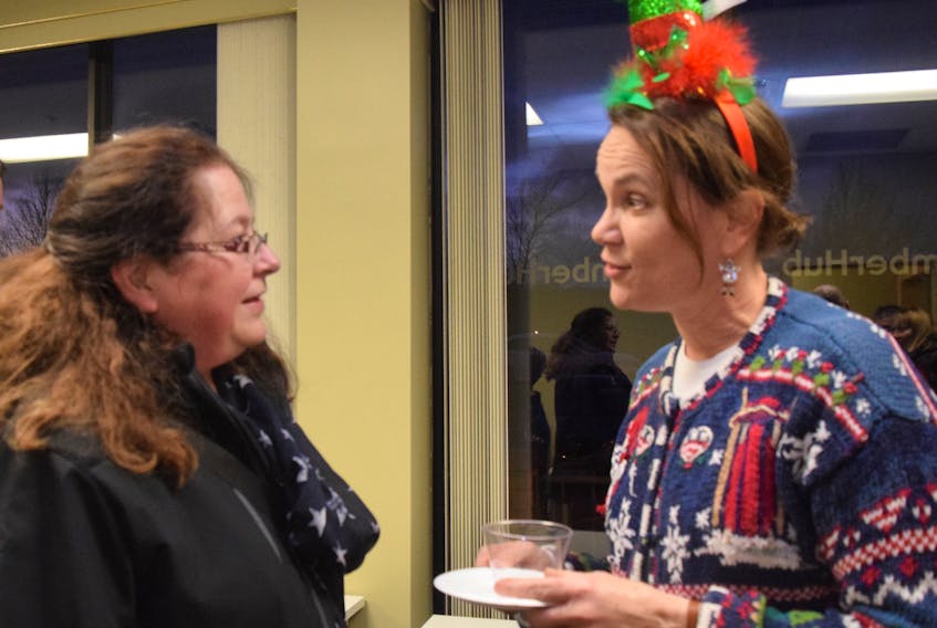 Nancy MacConnell-Maxner, at right, chats with Heather MacIsaac at a Pictou County Chamber of Commerce social.
