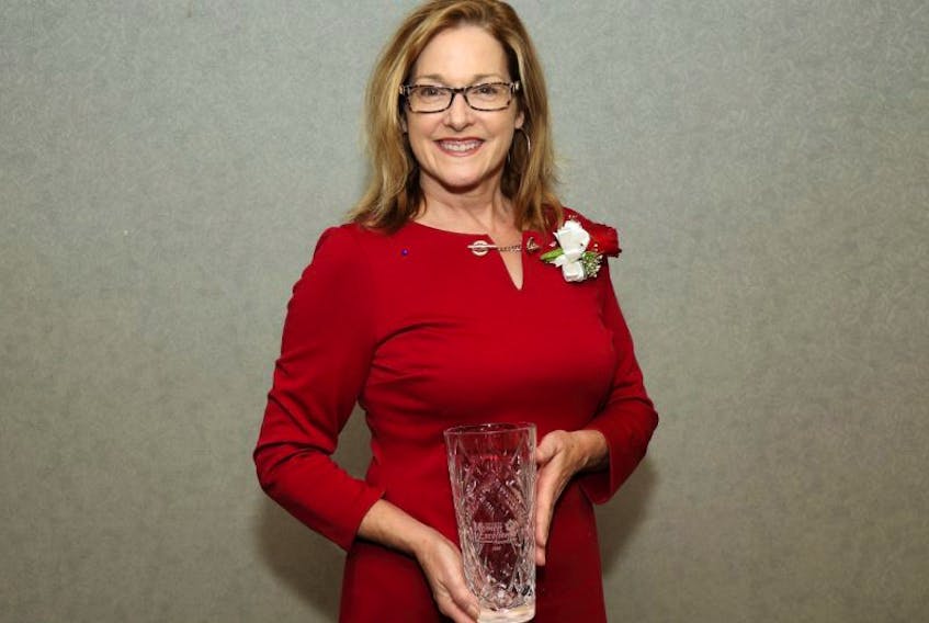 Patti Ryan of New Glasgow holds the Progress Women of Excellence Award she received on Wednesday night for Entrepreneur and Innovator.