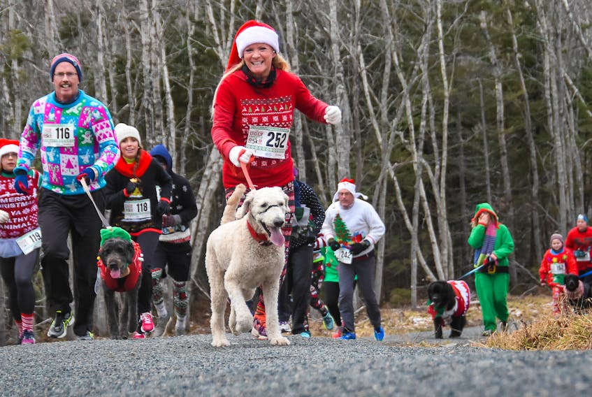Participants and their pets enjoyed taking part in the YMCA Ugly Sweater Run on Saturday.
