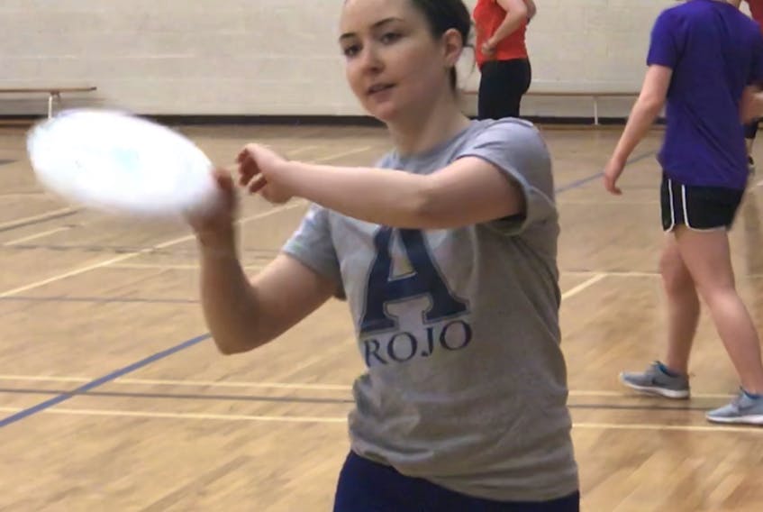 Emma Curley practices her Ultimate Frisbee moves at in the Northumberland Regional High School gym on Saturday.