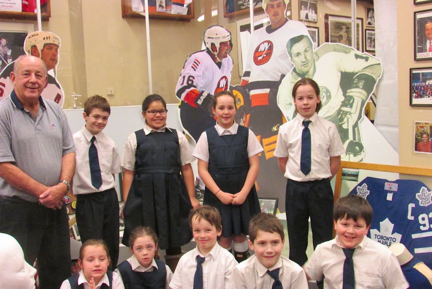 These students from St. Josephs Academy in Stellarton visited the Pictou County Sports Heritage Hall of Fame on Friday, asking many question about the hall for curator Barry Trenholm. In front row are: Ada Martin, Ana McArthur, Noah Fitt, Xavier McArthur and Nicholas MacKenzie, while in back are Martin McArthur, Sydnie Elms, Ella Fitt and John-Kay Martin.