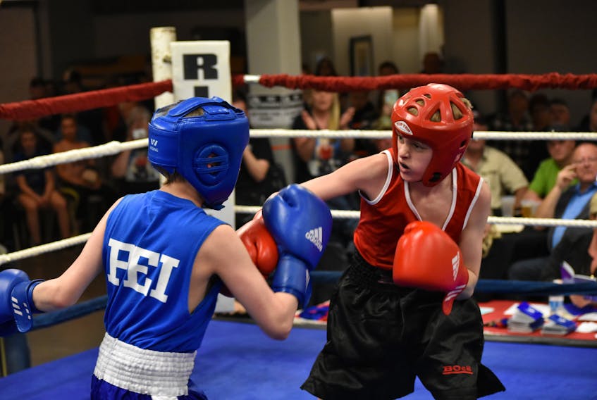 Carson Scholes of the Albion Boxing Club is shown in his match against Malcolm MacNeil of P.E.I.