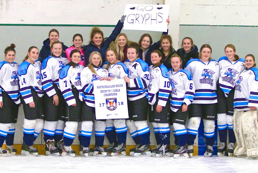 The North Nova Education Centre girls hockey team is shown with the NSSAF Northumberland Regional Division 1 banner, which they won on Wednesday. Shown, from left, back row: KJ Emery, Jenna Landry, Sophia Wornell, Camryn Halliday, Jensen Arsenault, Eva Wornell, Sarah MacNeil; front row: Rhea Young, Garyn Purvis, Keighan Decoff, Breanna Sandluck, Shalyn Bona, Paige MacDonald, Caitlin Taylor, Taylor Long, Lindsey MacDonald, Ashley MacDonald, Jayden Palmer, Victoria Dunn. Missing from photo is Heath Miller.