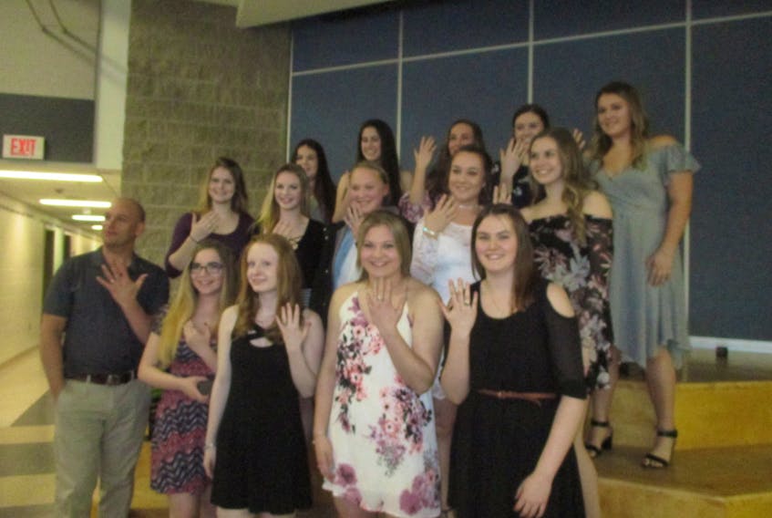 The Subway Selects female hockey program held its annual year banquet this past week during which time graduating players who were longtime members of the Subway minor hockey program were given rings by Subway sponsor Greg Burrows. Here, Burrows stands with year’s recipients, from the front, left:  Ryleigh Sutherland, Thea Waller, Biancia Bourgeois and Chloe MacDonald.  Middle row, left:  Taylor MacKenzie , Camryn Halliday, Leigha MacDonald,  Heath Miller, Lauren Hicks.  Back Row: Brianna Francis, Jenna Landry, Sarah MacNeil, Rhea Young and Sophia Wornell.