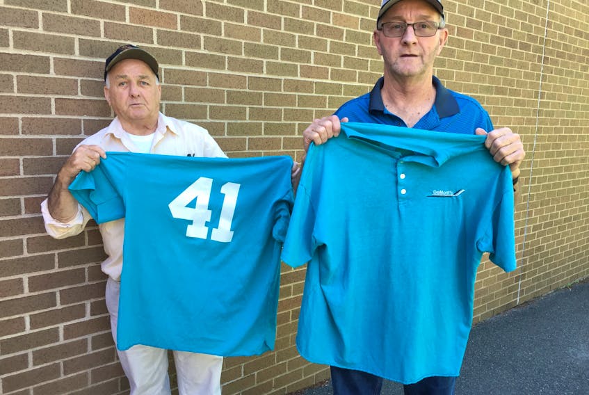 Philip MacKenzie accepted the donation of jerseys from Terry Chickness that will go to the Atlantic Burn Camp.
