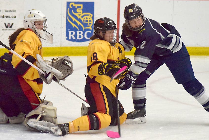 K.J. Emery of the Northern Subway Selects battles in front of the Station Six Fire net during Nova Scotia Female Midget AAA Hockey action on Saturday in Truro.