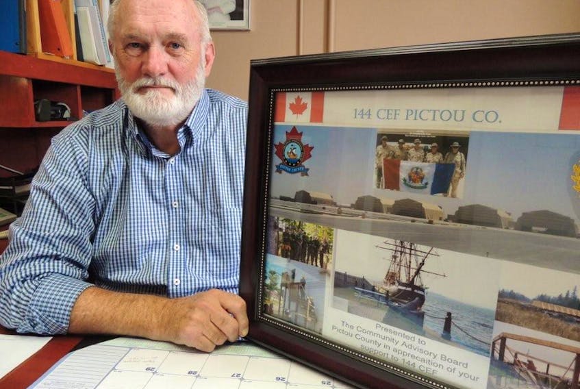 Cameron Beaton, new chair of the community advisory board at 144 Construction Engineering Flight Pictou County, looks over some history while sharing plans for a recruitment open house at 237 Welsford Street in Pictou, Saturday, Sept. 29, 10 a.m. to 3 p.m.