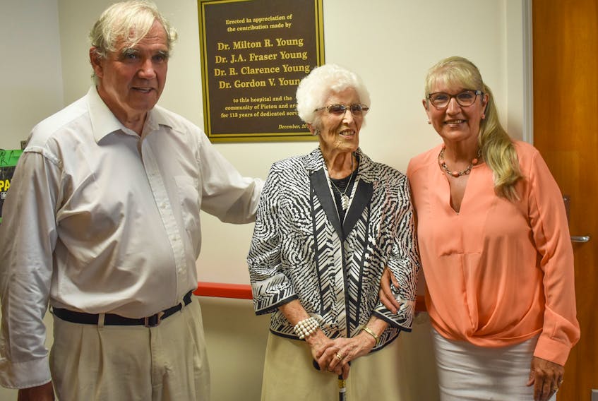 The Sutherland Harris Memorial Hospital Foundation has added Dr. Gordon Young’s name to a plaque inside the hospital which honours his father, grandfather and uncle who were also doctors in the town. From left are Dr. Gordon Young, his mother Doris and his sister Joan Young-Maltby.