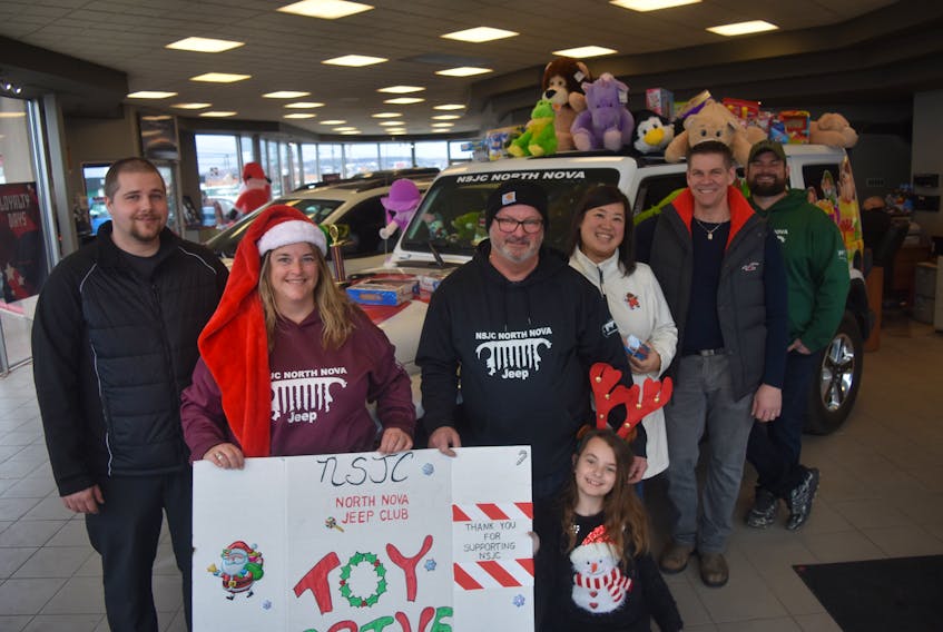 Scott Chapman with Atlantic Dodge, Belinda Ingemason, Kevin Boutilier with the Nova Scotia Jeep Club, Kayla Boutilier, executive director with United Way Pictou County Jessica Smith and the group’s president Aaron Millen, David Webber also with the Jeep Club. Their partnership has collected plenty of toys for those in need during the holidays.