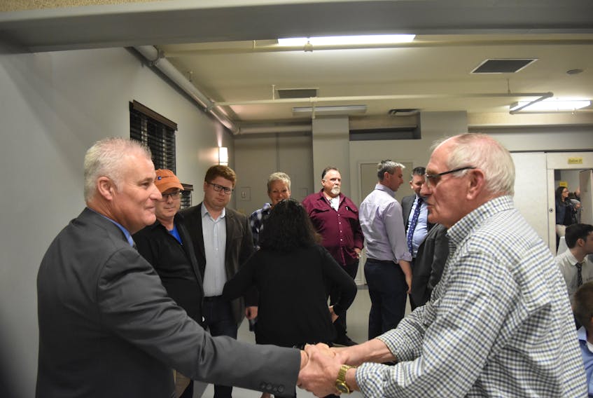 Roger MacKay shaking hands with well-wishers after it was announced that he will be the Conservative Party's nominee for Central Nova in the upcoming federal election.