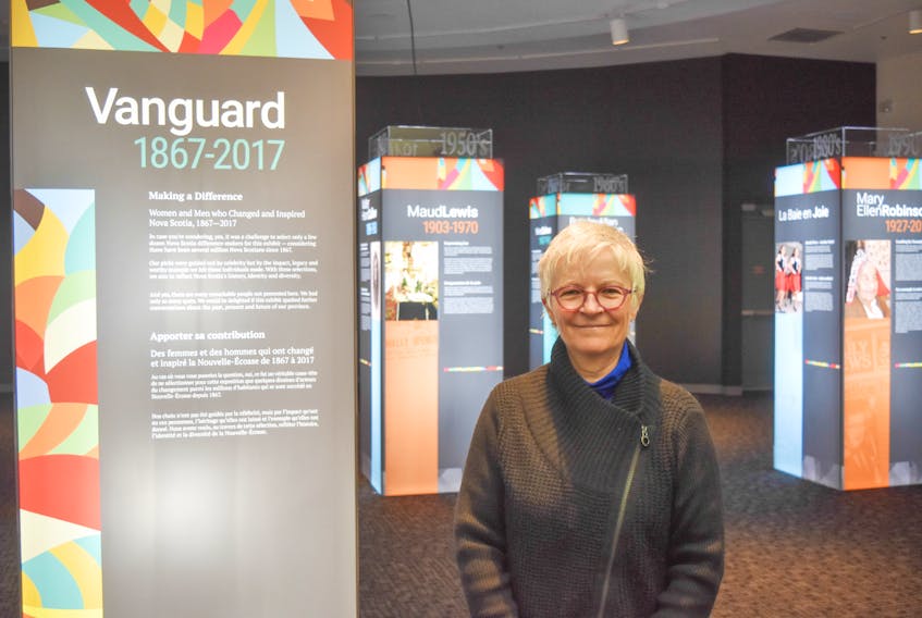 Debra McNabb stands next to the Vanguard exhibit which features 32 remarkable Nova Scotians and is on display at the Museum of Industry throughout the month of February
