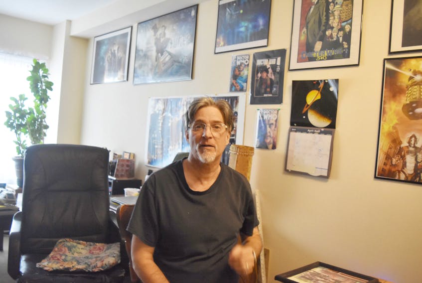 Hartling’s walls hold posters and pictures, displaying his affection for Star Wars and Dr. Who.