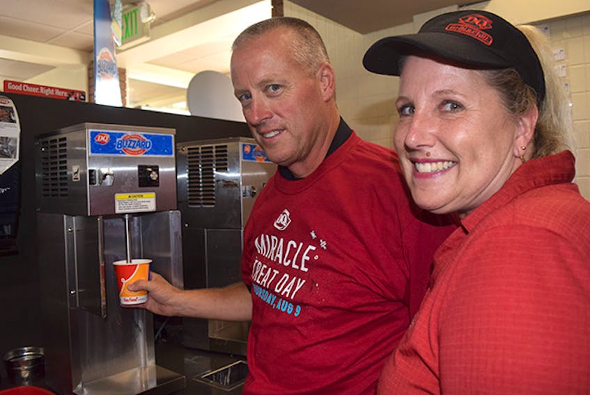 Const. Ken MacDonald of New Glasgow Police Services and Terri MacRae of Dairy Queen in New Glasgow were serving up DQ Blizzards on Thursday during the 16th annual Miracle Treat Day.