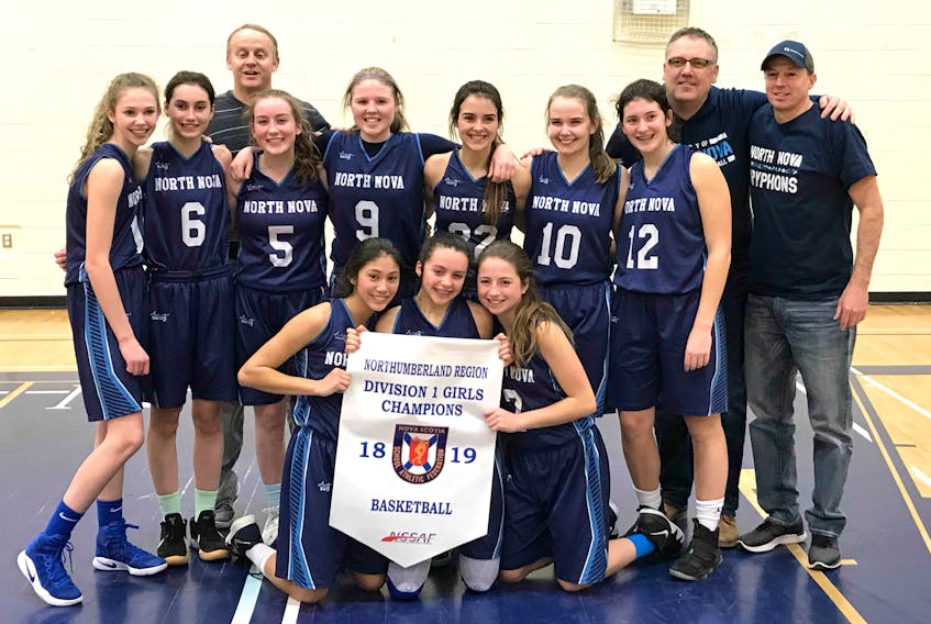 Shown are the NNEC Varsity Gryphons with their regional banner. In front from are: Katelyn Jota, Isa MacKay and Emily Arbuckle. In middle row are: Sarah Fast, Jade Butler, Raegan MacDonald, Jaden MacEachern, Kassi Brightman, Maddy MacMillan and Ali Morrison. In back are coaches Andy MacKay, Pat Delaney and Paul Arbuckle.
