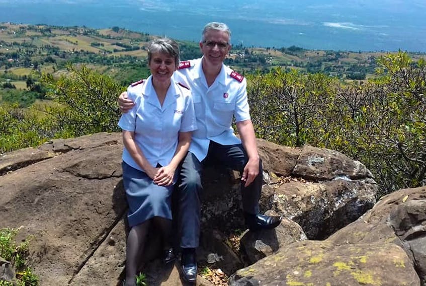 The Vincents, who are both from Newfoundland, sit on a rock with the Rift Valley in the background. The Salvation Army officers live in a gated compound in western Kenya with 15 other families. Security is essential for leaders in the country. There is a guard posted at the gate 24/7. CONTRIBUTED