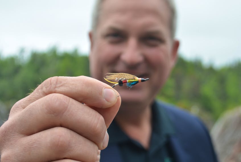 This fly dubbed the Portland Creek by creator Colby House of Massey Drive recently won the International Year of the Salmon fly competition in the designer’s choice category. Here, the Portland Creek is held by Gerry Byrne, the minister of fisheries and land resources, at an announcement at the Salmonid Interpretation Centre in Grand Falls-Windsor.