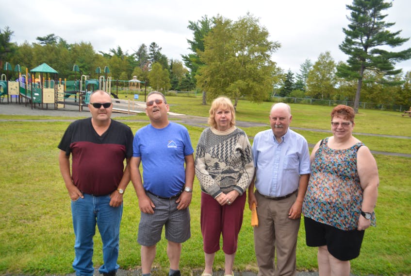 The Canadian Council for the Blind hosts an annual adult blind camp in August at the Lion Max Simms Memorial Camp. The camp gives adults with visual impairments the chance to interact and learn from people experiencing similar challenges. People involved with the camp include, from left to right, Brad Verge, Ron Hurley, Winston Penney, Michelle Bartram, and Emily Payne.