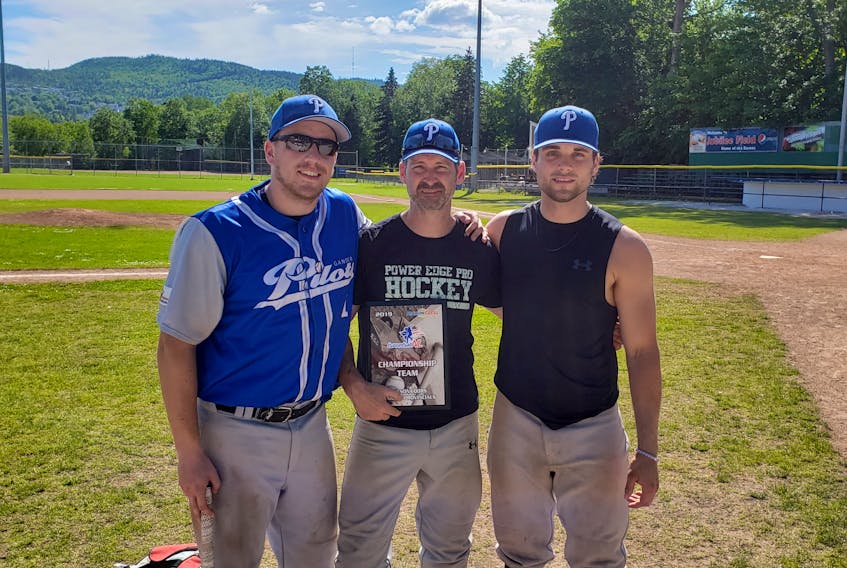 Blair Penney (left) is shown here with fellow Gander Pilots Dave Parsons (centre) and Riley King moments after winning the provincial senior B men's baseball championship in Corner Brook earlier this summer.