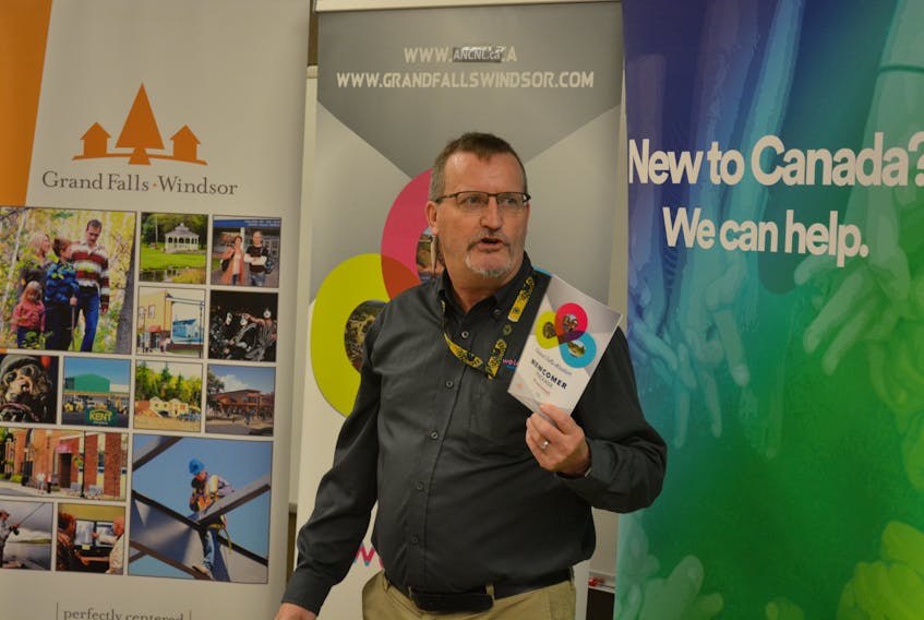 Welcome NL Grand Falls-Windsor project coordinator Randy Edison holds a copy of the group’s newcomer package for people coming to Grand Falls-Windsor for the first time.