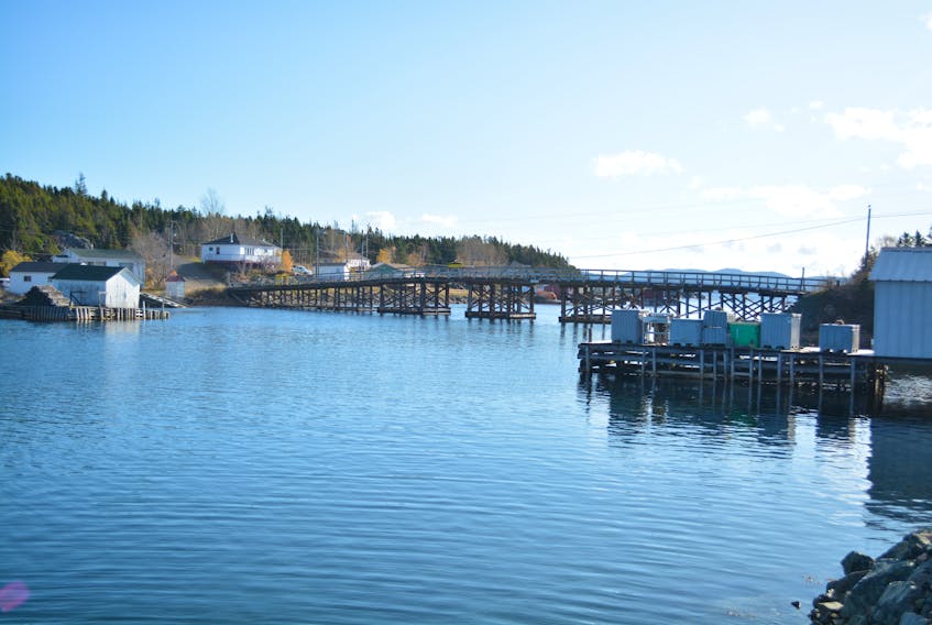 This bridge connects one part of Little Bay Islands to the other. The fishing gear in the foreground belongs to fisherman from Springdale who plans to return every spring.