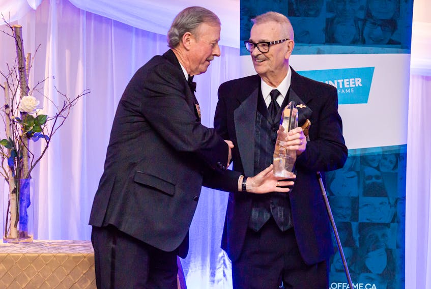 Durrell’s Robert Wilton (right) is presented with his Newfoundland and Labrador Volunteer Hall of Fame award by Bill Mahoney, Volunteer Hall of Fame selection committee member, during an induction ceremony in St. John’s on Nov. 14. Photo courtesy Jonathan Wells Photography