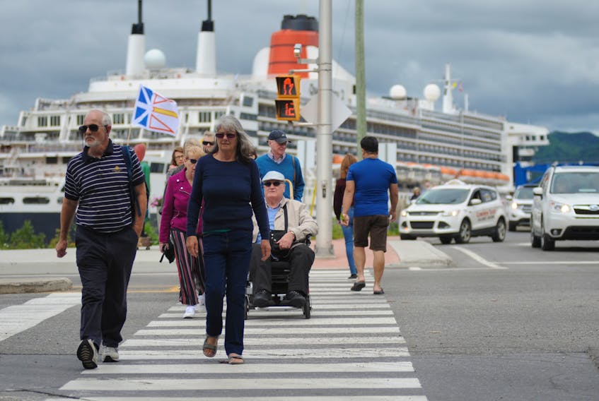 Passengers from the Queen Mary 2 make their way towards downtown Corner Brook during the massive cruise ship’s visit to the city Wednesday.