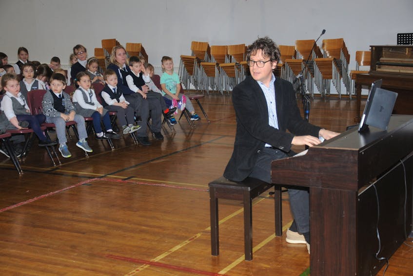 Pianist Daniel Wnukowski interacts with students during his performance at Immaculate Heart of Mary School in Corner Brook Monday afternoon.