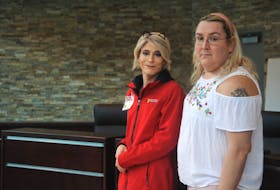 Charlotte Gauthier (left) and Quinn Jesso attended an event to commemorate Transgender Day of Remembrance at the Corner Brook's city hall Nov 20. STEPHEN ROBERTS / THE WESTERN STAR