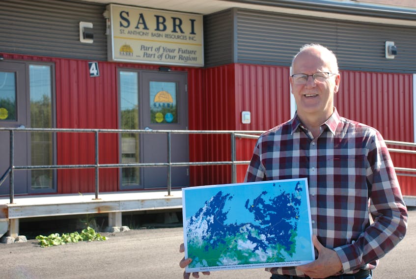 St. Anthony Basin Resources Inc. executive director Sam Elliott, pictured, is hopeful new cell towers will be up and running by the end of December 2019. He holds a map showing which areas will have coverage once the towers are installed. STEPHEN ROBERTS/THE NORTHERN PEN