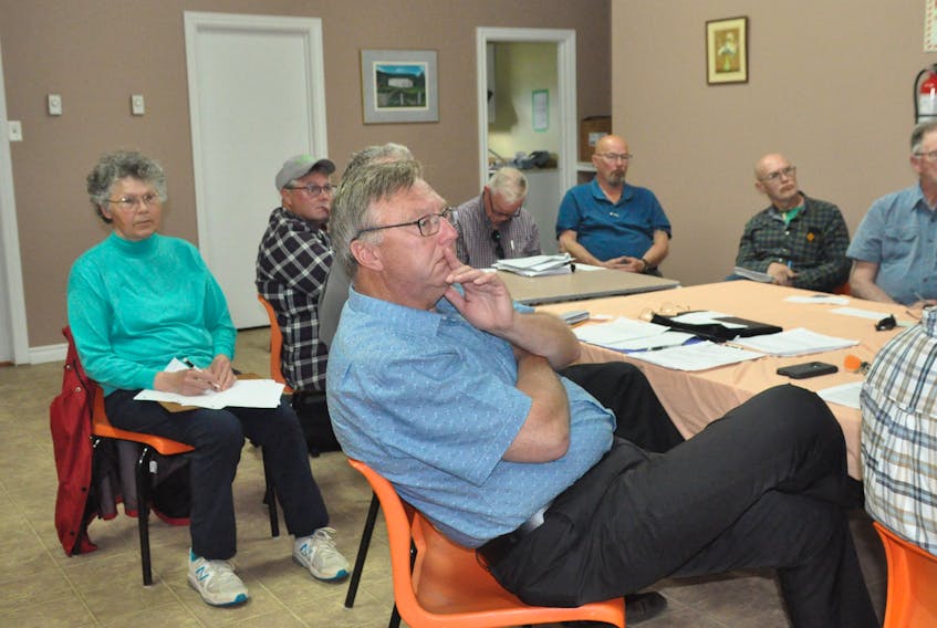 Tony Wakeham, front, MHA for Stephenville – Port au Port District, was one of about a dozen people who took part in a meeting of the Port au Port Bay Fishery Committee in Port au Port East on Thursday, July 18. FRANK GALE/ THE WESTERN STAR