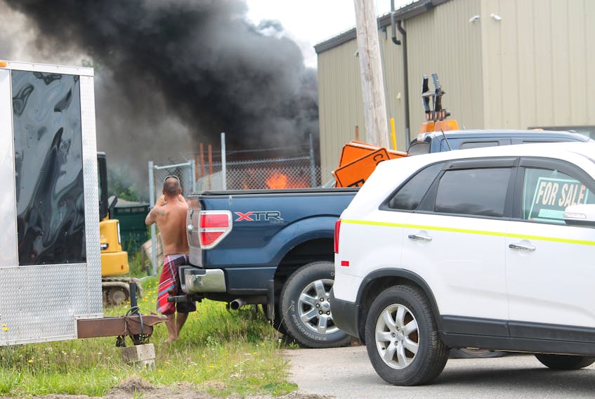 A fire in a truck box, being used as a storage shed, at the rear of Eddy Services on Prince Rupert Drive in Stephenville on Monday, July 29 resulted in a lot of smoke but not a lot of damages, according to Craig Eddy of the business. He said there were truck tires in the shed and the fire was contained to it. Here, some of the fire is seen, which resulted in Prince Rupert Drive being closed to traffic for more than an hour while firefighters doused the high flames. There were no injuries as a result of the fire. FRANK GALE/ THE WESTERN STAR