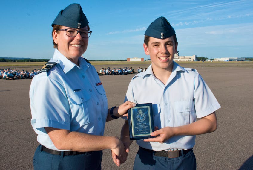 FCpl Zachary Patey, right, receives the award for top cadet in basic survival from LCol Allison Wilton, the Commanding Officer of the Greenwood Cadet Training Centre. CONTRIBUTED BY CAPT. ATHENA NICHOLSON